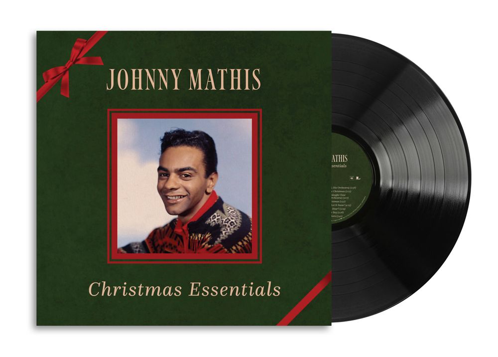 the album cover for Johnny Mathis - Christmas Essentials
