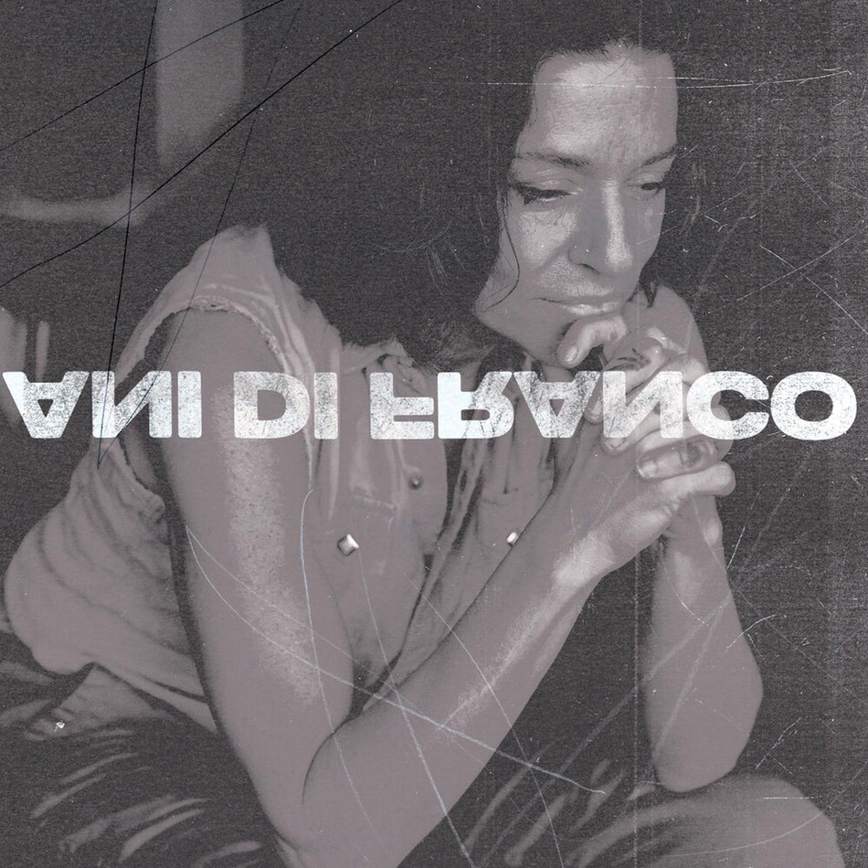the album cover for ANI DIFRANCO	 - UNPRECEDENTED SH!T [INDIE EXCLUSIVE COKE BOTTLE CLEAR LP]	